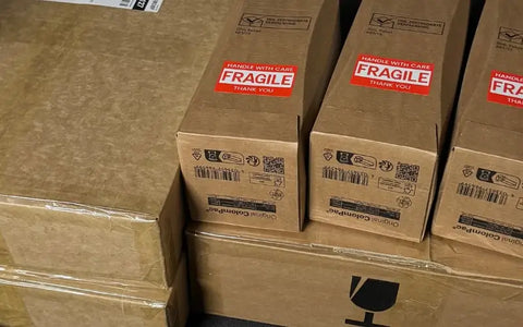 Professional wine shipping boxes with fragile handling labels showing secure wine delivery packaging Australia wide