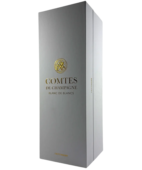 White and gold presentation box of Taittinger Comtes de Champagne Grand Cru Blanc de Blancs 2013, premium French sparkling wine packaging.