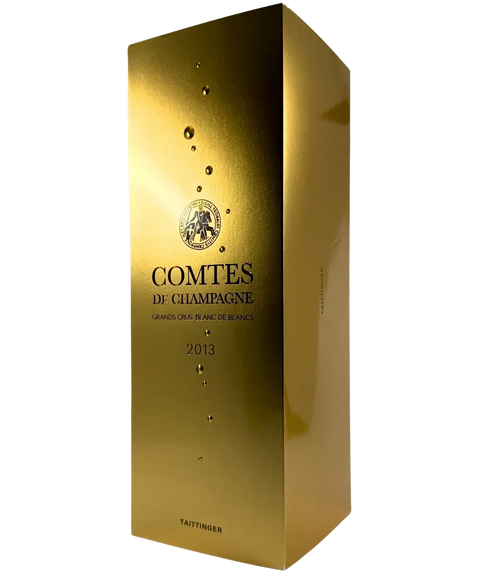 Gold presentation box of Taittinger Comtes de Champagne Grand Cru Blanc de Blancs 2013, luxury Champagne gift packaging with embossed crest.