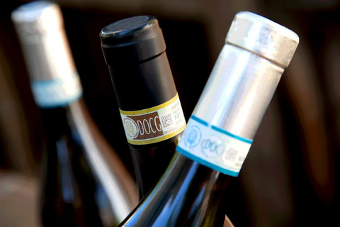 Close-up photo of Italian wine bottles with DOCG and DOC quality classification seals