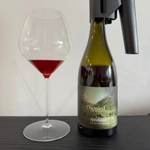 2024 Dappled Appellation Pinot Noir Yarra Valley wine bottle with glass showing ruby red wine colour