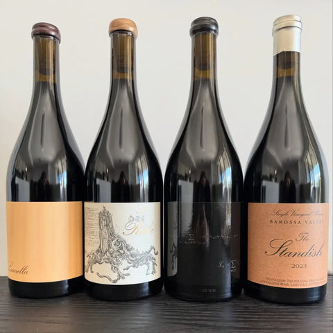 Four premium Barossa Valley Shiraz wines from the 2023 Standish release, featuring Lamella, The Relic, The Schubert Theorem, and The Standish bottles lined up on a black table.