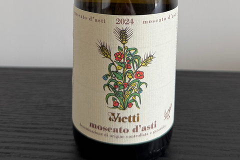 Vietti Moscato d'Asti wine bottle with traditional Italian label showing floral botanical design