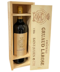 Opened wooden wine box containing Château Gruaud Larose 2005 Saint-Julien bottle with protective compartments