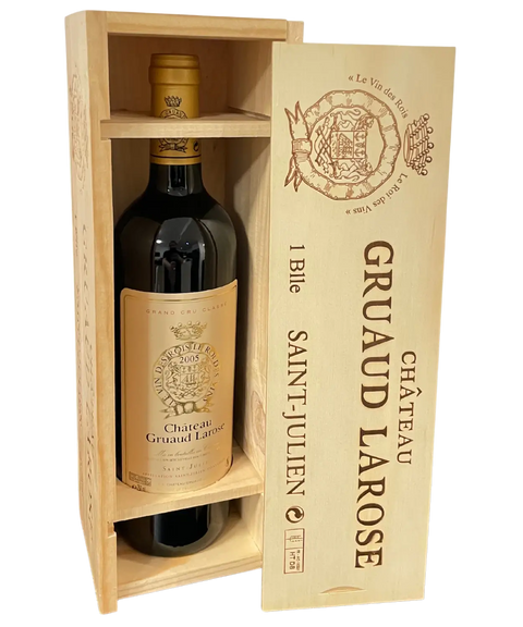 Opened wooden wine box containing Château Gruaud Larose 2005 Saint-Julien bottle with protective compartments