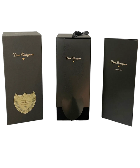 Dom Pérignon Vintage 2012 Champagne luxury presentation gift box in black with gold branding, three-panel view.