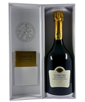 Open presentation box displaying Taittinger Comtes de Champagne Grand Cru Blanc de Blancs 2013 bottle, luxury Champagne gift set.