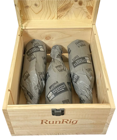 2016 Torbreck RunRig wooden wine case opened showing three tissue-wrapped red wine bottles with branded protective packaging