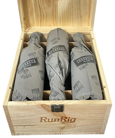 2021 Torbreck RunRig wooden wine case opened showing three tissue-wrapped red wine bottles with branded protective packaging